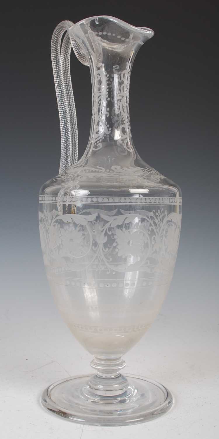 A 19th century glass ewer, probably Holyrood Glassworks, in the Roman style with double spiral