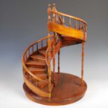 A reproduction mahogany table-top spiral staircase display stand, Bevan Funnell, 62cm high x 45cm