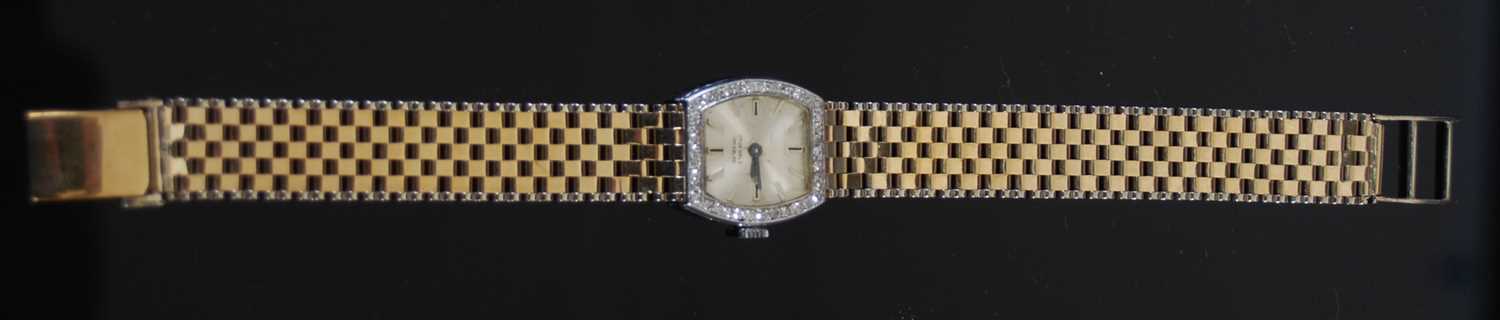 A 9ct gold and white metal diamond set cocktail watch, the silvered dial with baton numerals, within