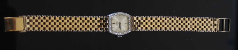 A 9ct gold and white metal diamond set cocktail watch, the silvered dial with baton numerals, within