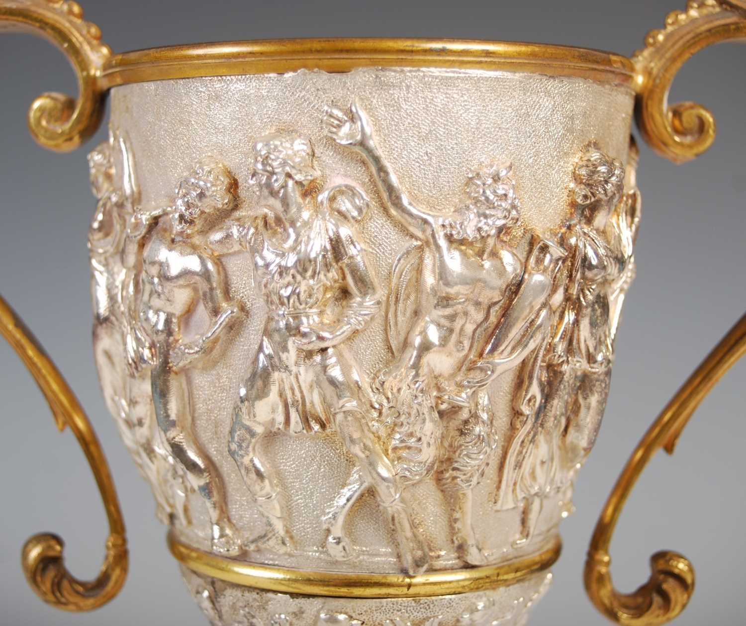 A Victorian silver-plated and gilt metal twin-handled cup, decorated in high relief with a frieze of - Image 3 of 7