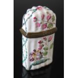 An 18th century Battersea enamel scent bottle case, the fluted body decorated with flowers and
