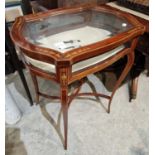 An Edwardian mahogany and marquetry inlaid bijouterie table with bevelled glass top and sides,