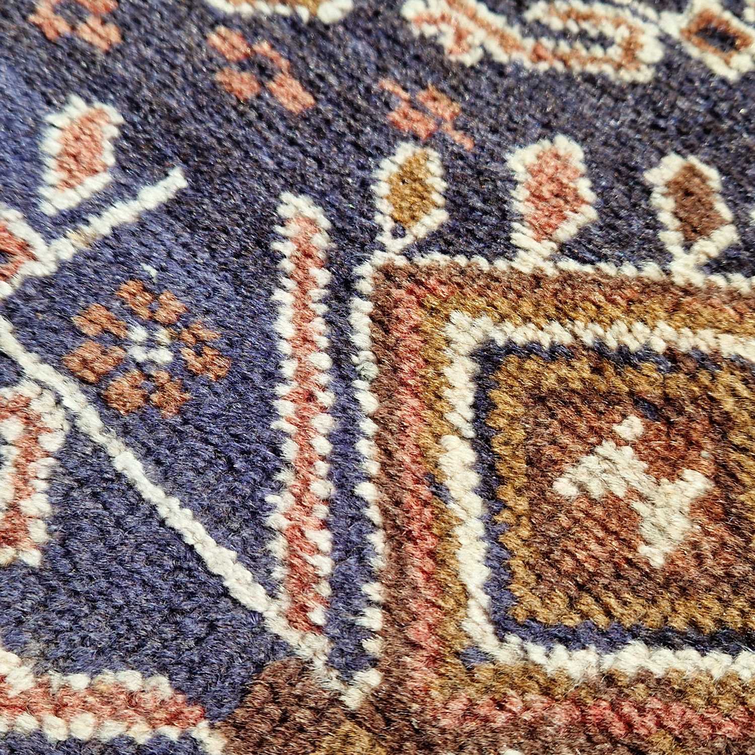 A Persian rug, 20th century, the blue ground decorated in white madder and ochre coloured threads - Image 4 of 4
