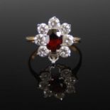 A 9ct gold almandine garnet and rare-earth synthetic garnet, in imitation of diamond, cluster