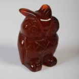 A red agate, possibly carnelian, carving of an owl, 4.2cm high.