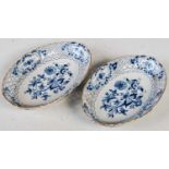 A pair of Meissen porcelain, blue and white onion pattern oval shaped dishes, with pierced rims