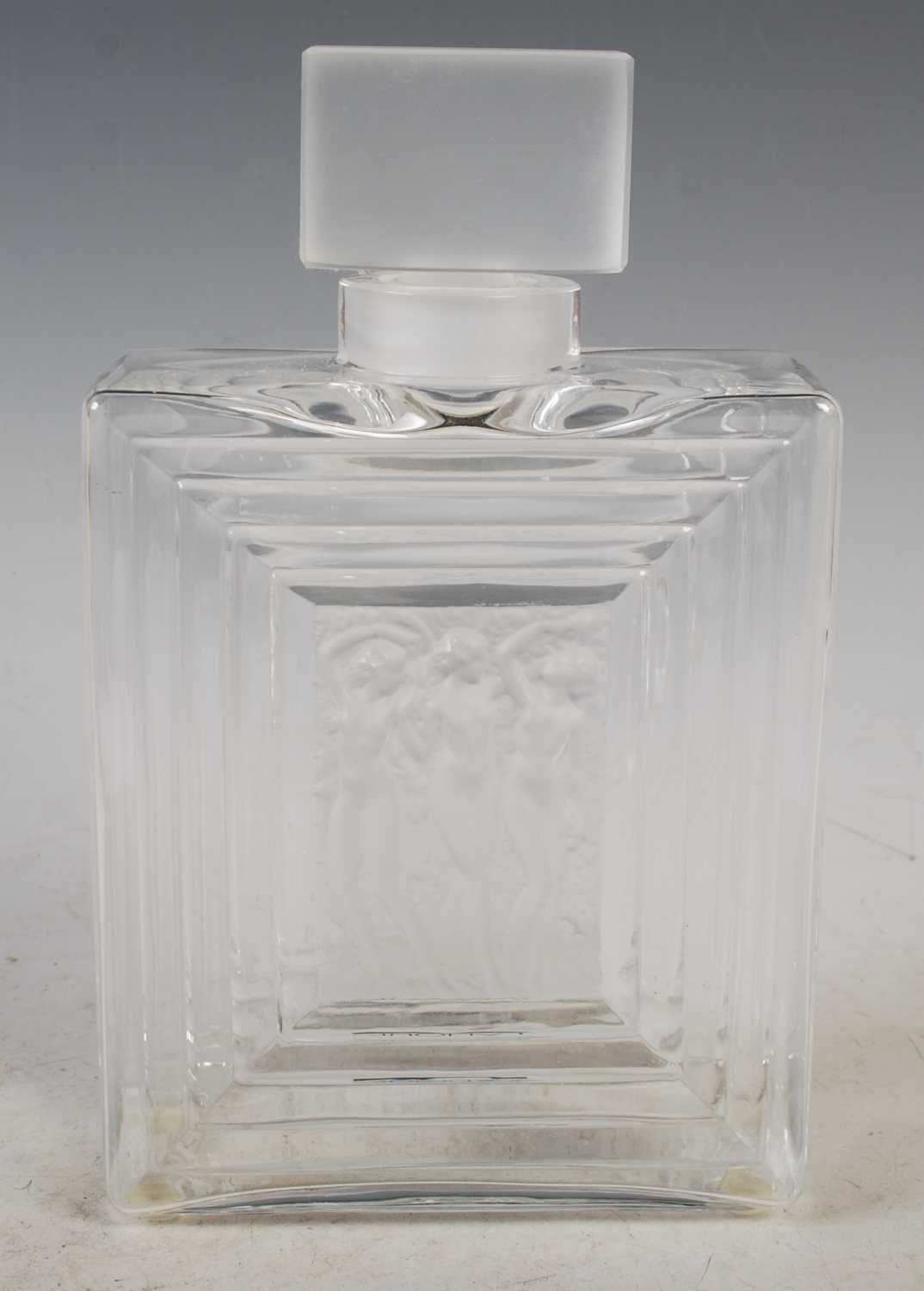 Lalique, a clear and frosted glass 'Three Nudes' decanter and stopper, 20cm high.