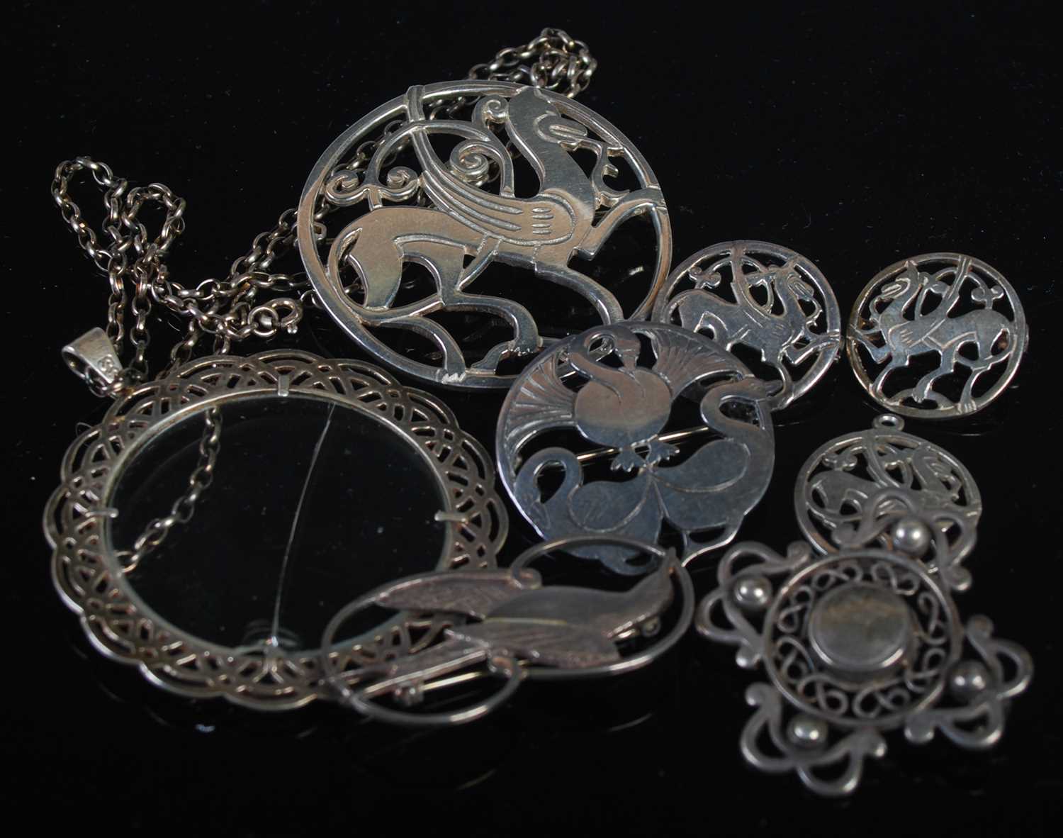 A collection of eight assorted Shetland silver jewellery items to include various brooches and a