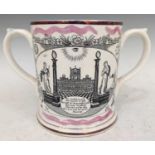 A 19th century two handled Masonic frog mug with transfer printed decoration, 14.5cm high.