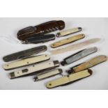 A collection of eleven assorted vintage pocketknives together with a carved mother of pearl page