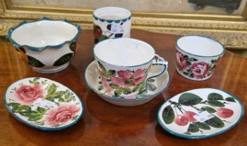 A collection of Wemyss pottery to include cup and saucer, decorated with dog roses, oval dish