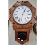 A vintage oak wall clock, the black and white roman numeral dial inscribed 'Newhaven USA', the
