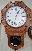 A vintage oak wall clock, the black and white roman numeral dial inscribed 'Newhaven USA', the