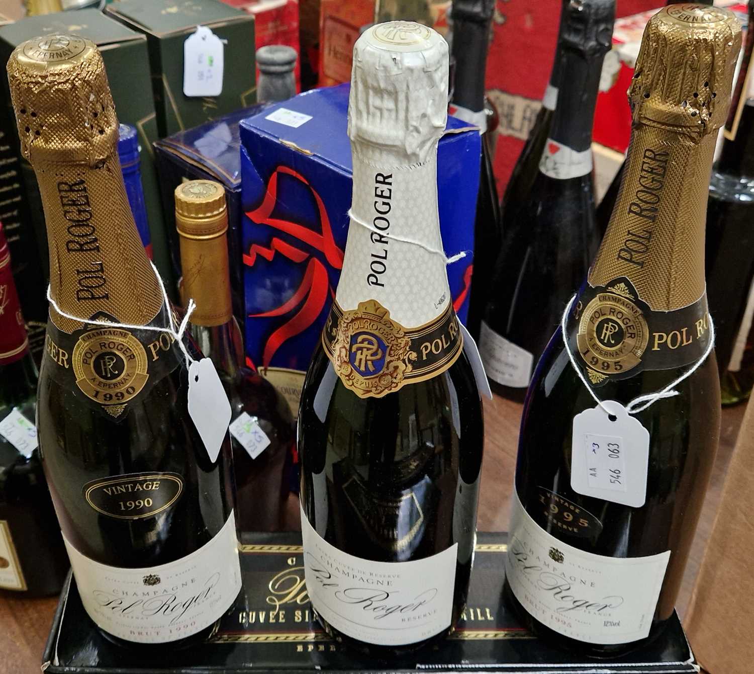 Three bottles, a Pol Roger Champagne Brut 1990 vintage, 750ml, a Pol Roger Champagne Brut 1995