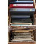 A box containing various stamp folios/albums, first day covers, loose stamps etc.