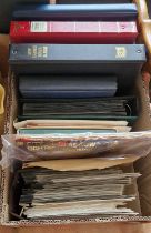 A box containing various stamp folios/albums, first day covers, loose stamps etc.