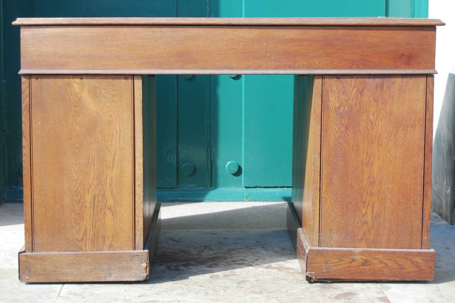 A late 19th century oak pedestal desk, the rectangular top with a moulded edge over a central frieze - Image 8 of 8