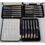 Two cased sets of silver handled afternoon tea knives together with a cased set of six silver plated