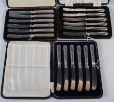 Two cased sets of silver handled afternoon tea knives together with a cased set of six silver plated