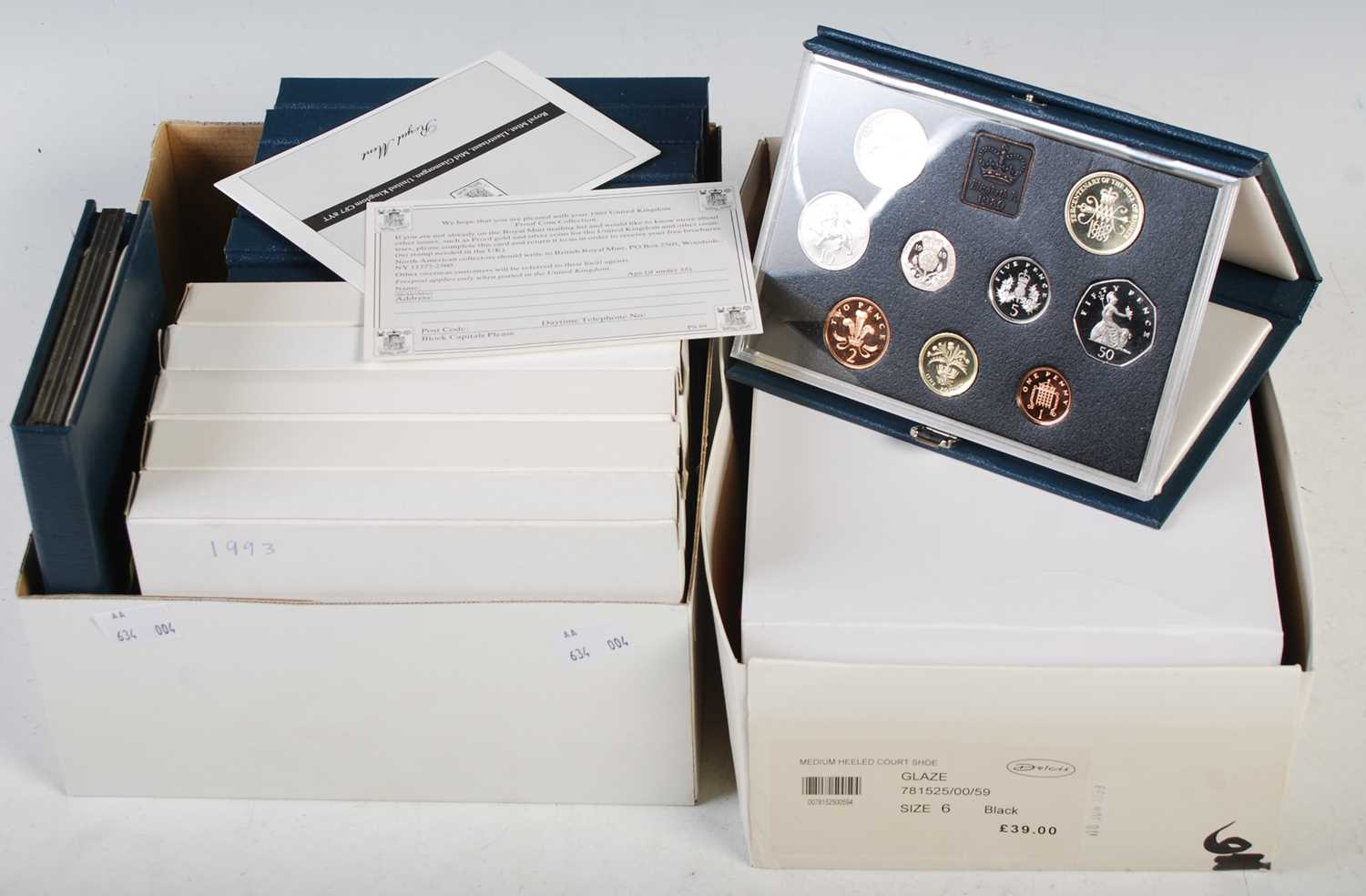 Two boxes of assorted Royal Mint UK proof coin collections circa 1980’s, 1990’s, early 2000’s.