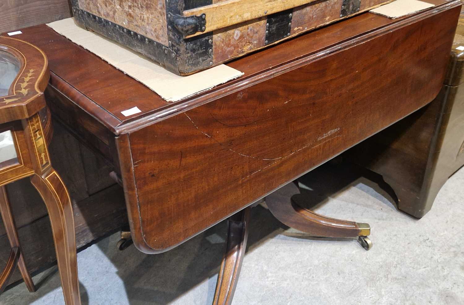 A 19th century mahogany drop-leaf pedestal table, the rectangular top above a single end drawer,