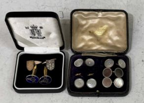 A pair of London silver shield-shaped cufflinks together with a pair of yellow metal and blue enamel