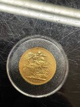 A Victorian gold sovereign dated 1884.