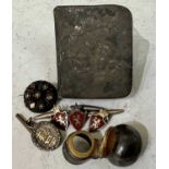 A collection of assorted silver and white metal items to include a silver bottle top with hinged