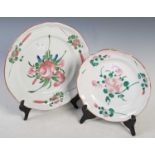 Two antique French Faience pottery plates, both decorated with scattered foliate sprays, one 28cm