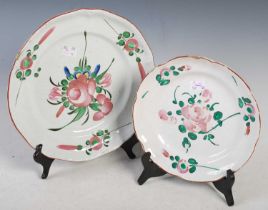 Two antique French Faience pottery plates, both decorated with scattered foliate sprays, one 28cm