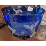 A 20th century Bristol blue glass overlaid bowl with wheel-cut decoration to reveal birds in flight,