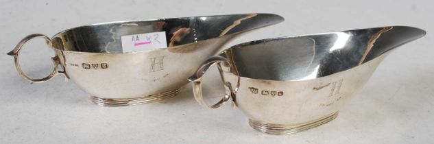 A pair of Edward VIII silver sauceboats, Chester, 1936, both engraved with the initial 'H', gross