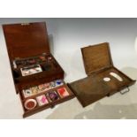 A late 19th century mahogany painters box, the hinged top opening to a fitted interior containing