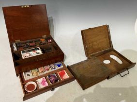 A late 19th century mahogany painters box, the hinged top opening to a fitted interior containing