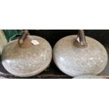 A pair of granite curling stones.
