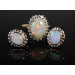 A yellow and white metal opal and diamond set ring, stamped 18CT, ring size L, together with a