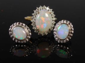 A yellow and white metal opal and diamond set ring, stamped 18CT, ring size L, together with a