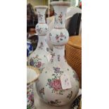 A pair of Samson porcelain 'Famille Rose' style armorial bottle vases, painted marks to base, each