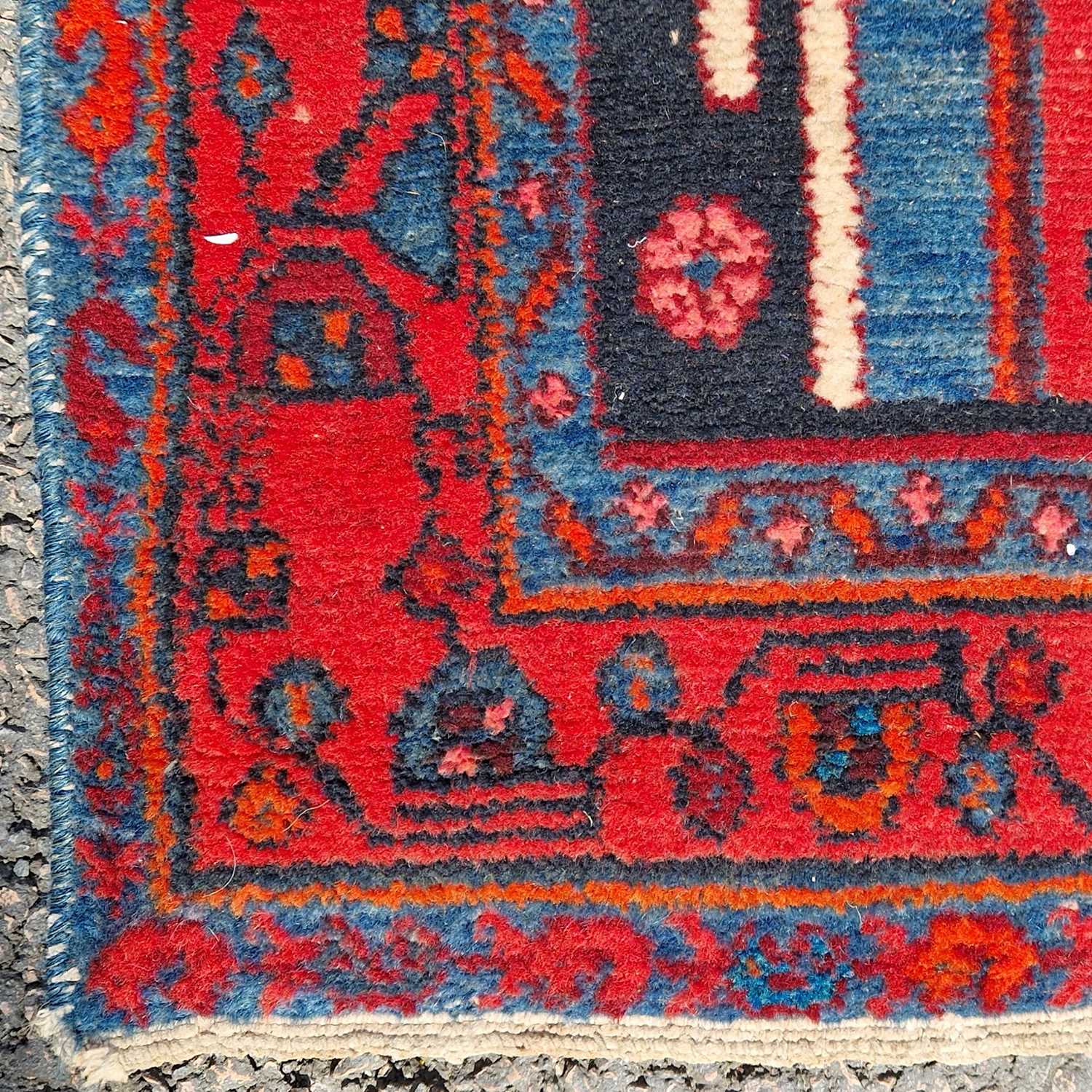 A Persian long rug, 20th century, the charcoal coloured ground centred with an ivory medallion and - Bild 3 aus 5