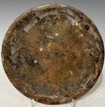 A 20th century stoneware plate with fossil inclusions, 24cm diameter.