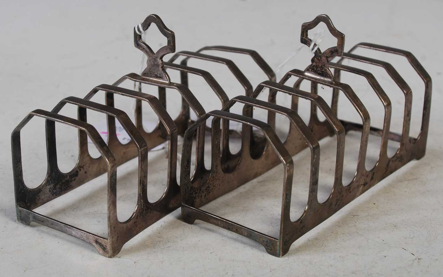 A pair of Edward VIII silver seven bar toast racks, Sheffield 1936, makers mark E.V, 11cm long,
