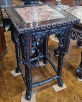 A Chinese darkwood jardiniere stand, Qing Dynasty, the square top with mottled red and white