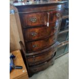 A reproduction mahogany bowfront chest on chest, the upper section fitted with three drawers on a