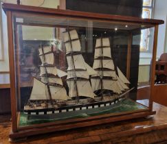A model ship in glass display case 'Yallum', 80 cm wide x 56cm high.
