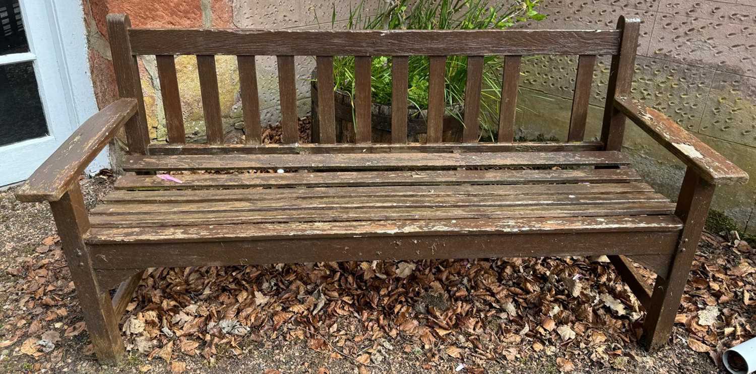 A wooden garden bench, 159cm wide.