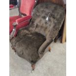 A Victorian mahogany brown velvet upholstered slipper chair.