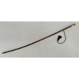 A late 19th Century Malacca riding crop with detailed gilt handle, the top inscribed 'G. Gregory',