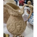 A 19th century salt glazed pottery jug/pitcher moulded in relief in the manner of Ridgeway, 25cm