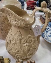 A 19th century salt glazed pottery jug/pitcher moulded in relief in the manner of Ridgeway, 25cm